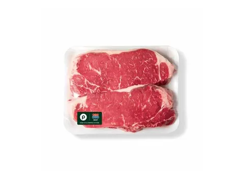 Two boneless New York strip steaks in a Publix tray
